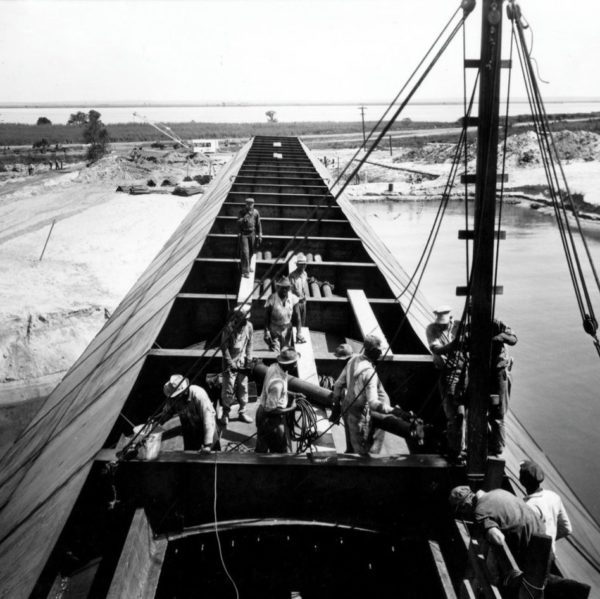 Shipyard workers weld sections of the Bankhead Tunnel ca. 1945.