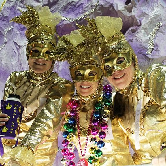 Three masked float riders in Maids of Mirth parade